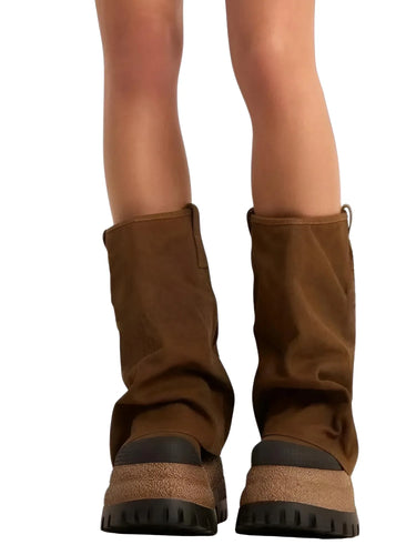 Brown platform slouch boots with black soles on a white background